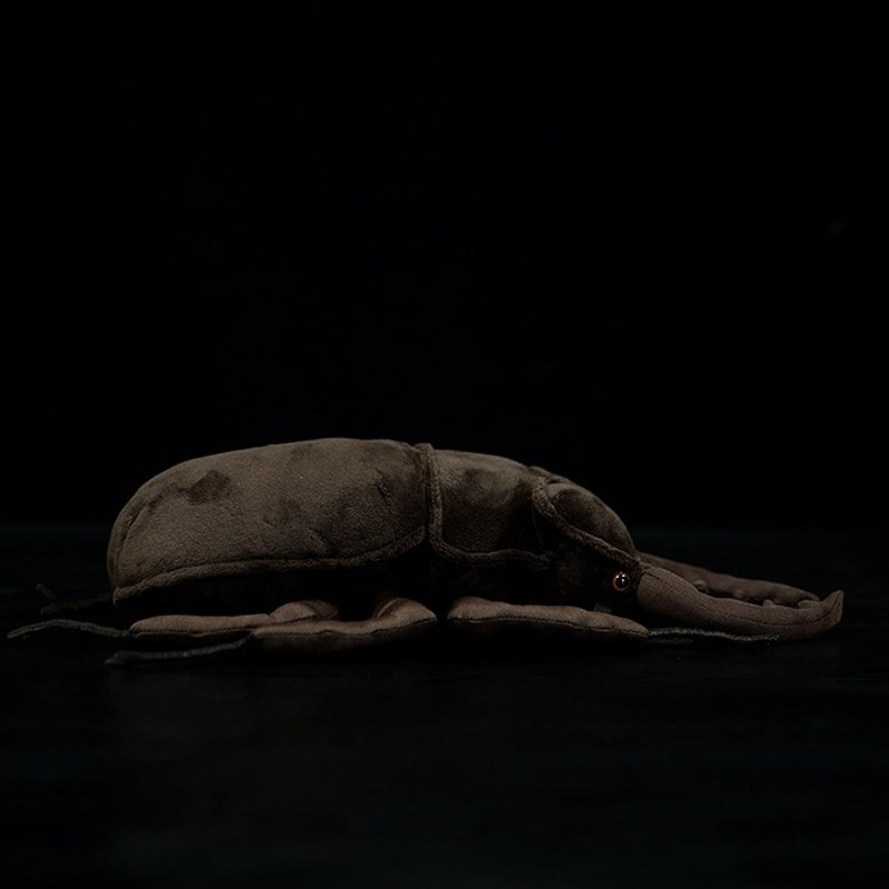Profile view of a lifelike stag beetle plush toy, highlighting its realistic body by SoftDaysLab