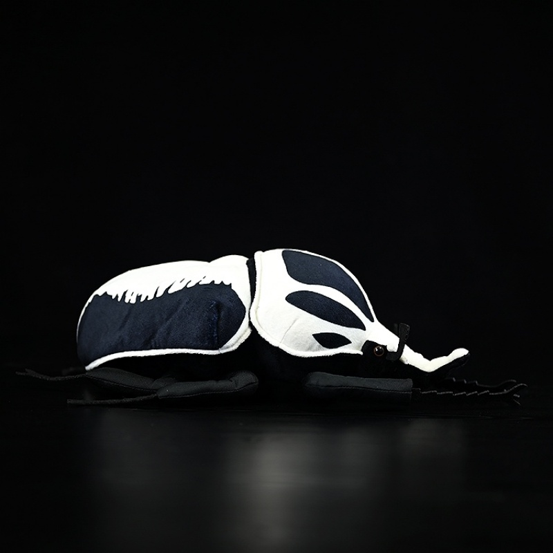 Profile view of the Goliath beetle plush toy, featuring its soft body and lifelike details by SoftDaysLab