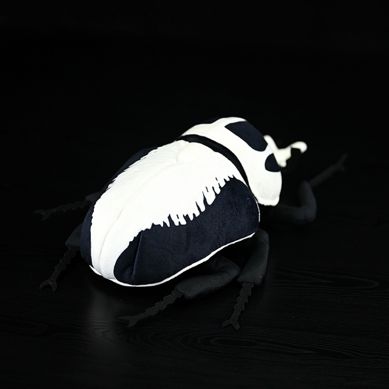Rear angle of the Goliath beetle plush toy, highlighting its detailed back and legs