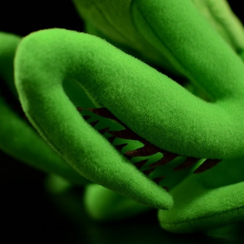 Detailed close-up of green Chinese mantis plush claws, showcasing realistic texture and design