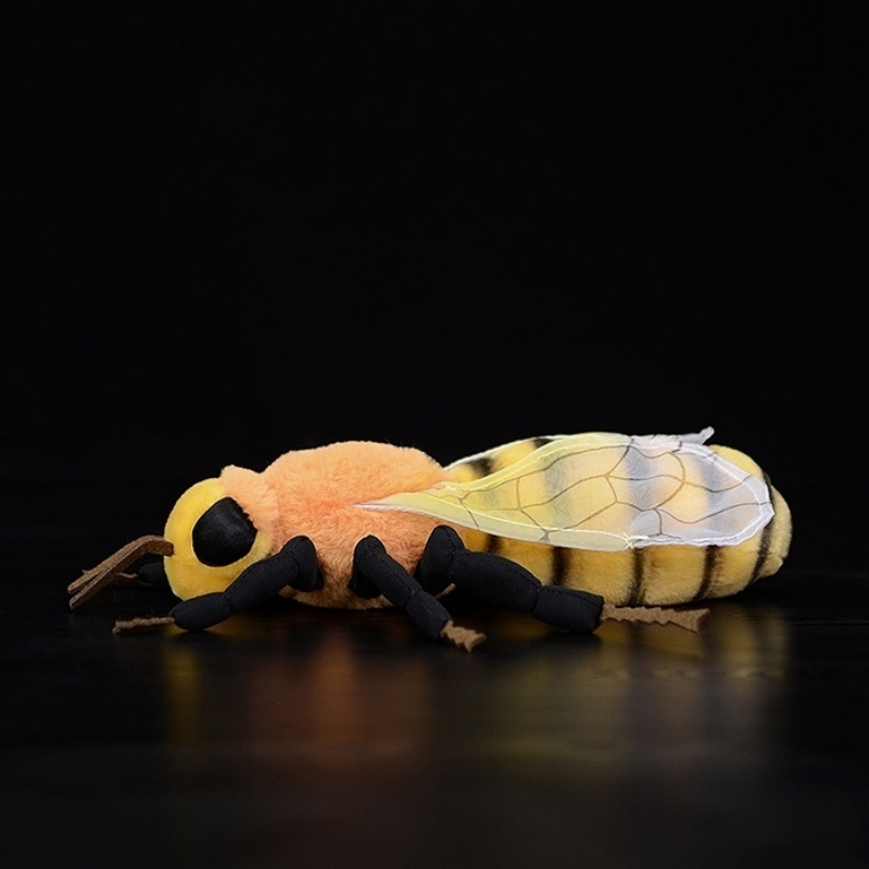 Side profile of realistic bee plush toy with soft legs and detailed design.