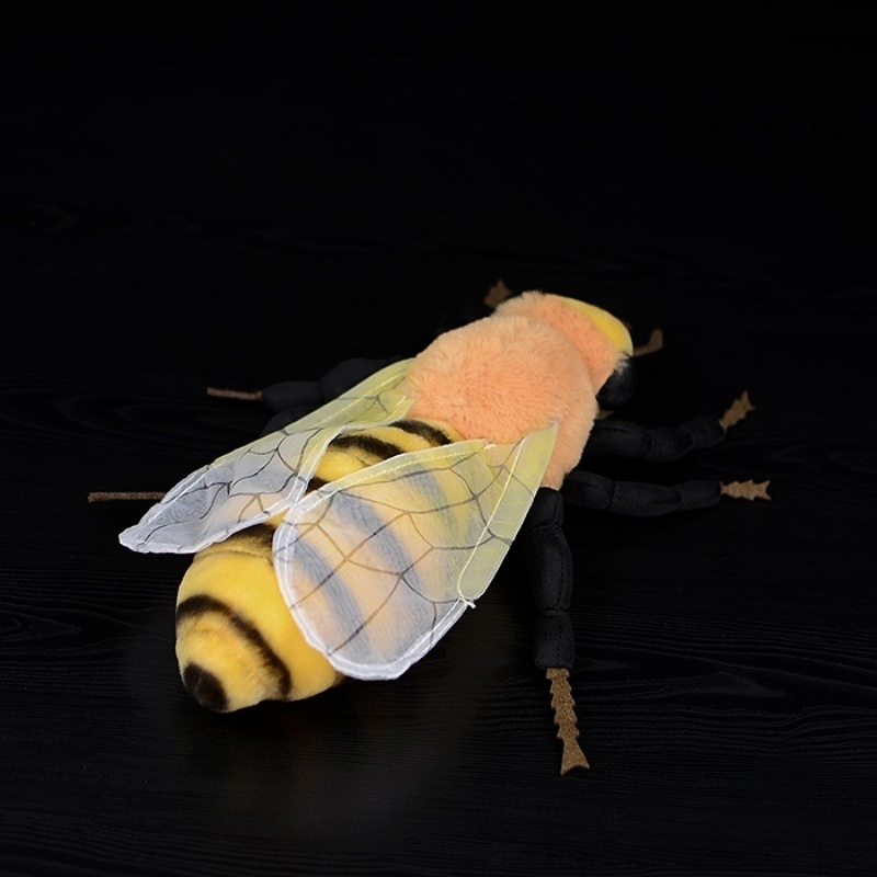 Rear view of bee plush toy showing transparent wings and detailed stripes by SoftDaysLab