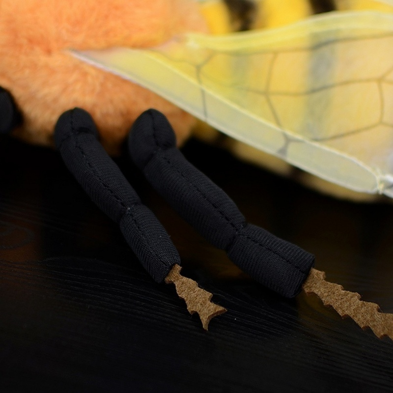 Close-up of the plush bee's detailed legs and transparent wings by SoftDaysLab