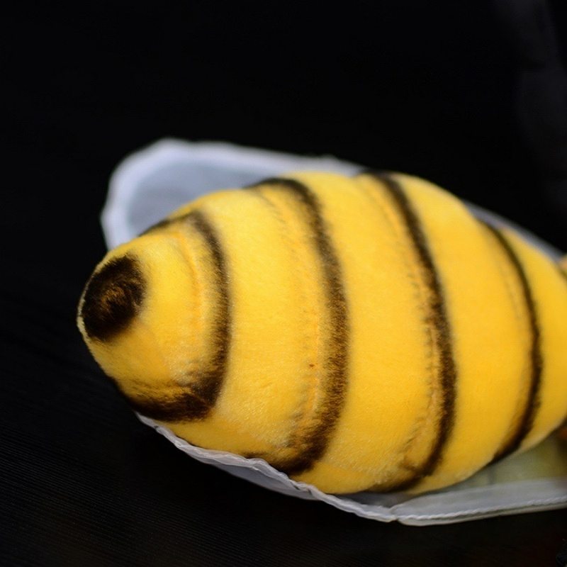 Close-up of plush bee's realistic striped abdomen with soft fabric by SoftDaysLab