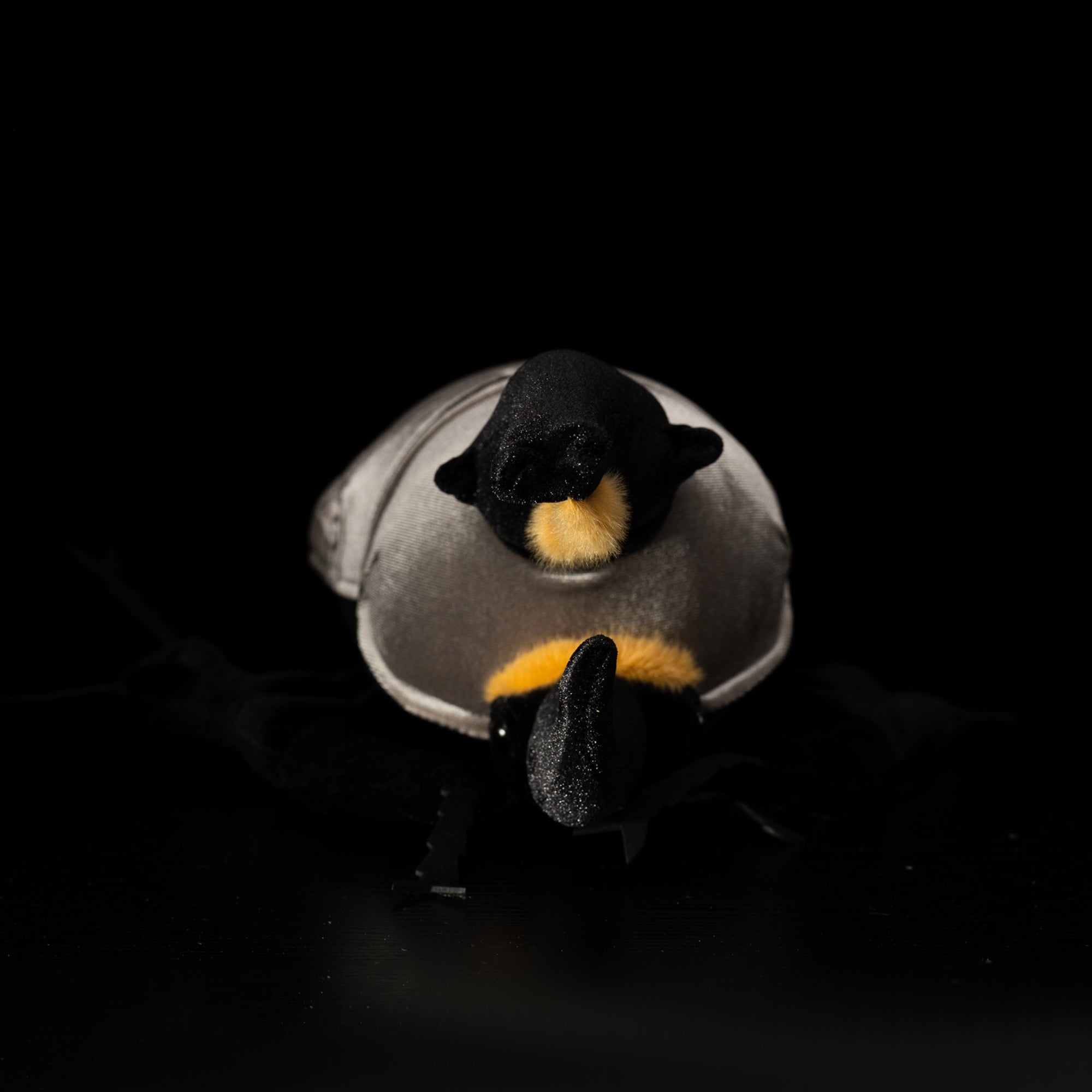 Front view of plush Western Hercules beetle showcasing its prominent horns and lifelike design