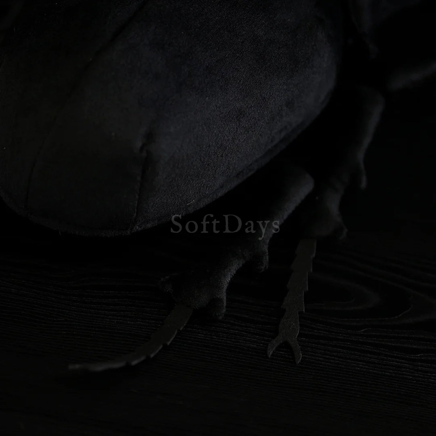 Close-up of lifelike Prosopocoilus confucius beetle plush leg details, replicating an authentic beetle look