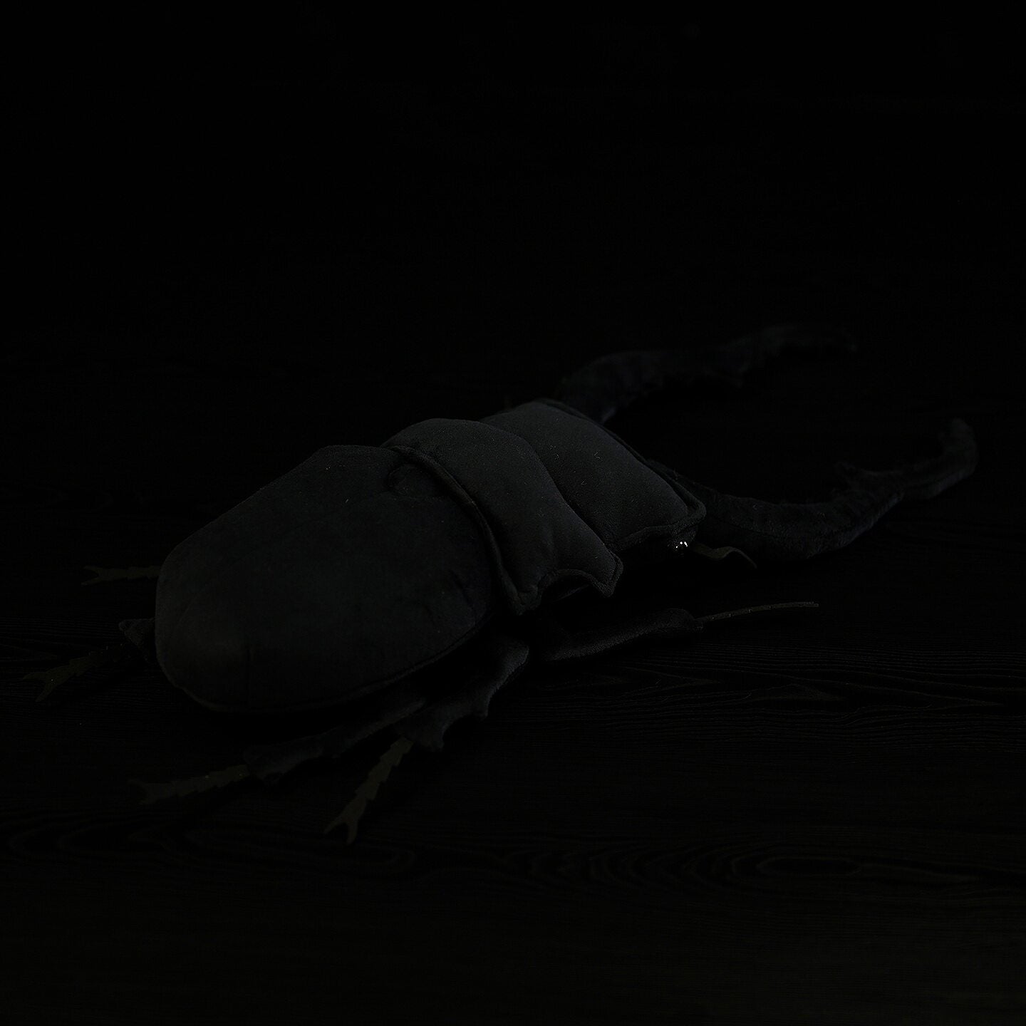 Back view of Giraffe Stag Beetle plush, showing soft fabric and realistic leg details for collectors