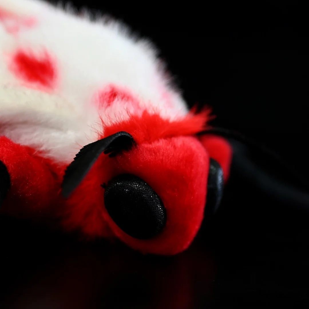 Zoom-in on the head detail of the Rosy Ermine Moth Plush by SoftDaysLab®, celebrating Trosia nigropunctigera's vibrant design