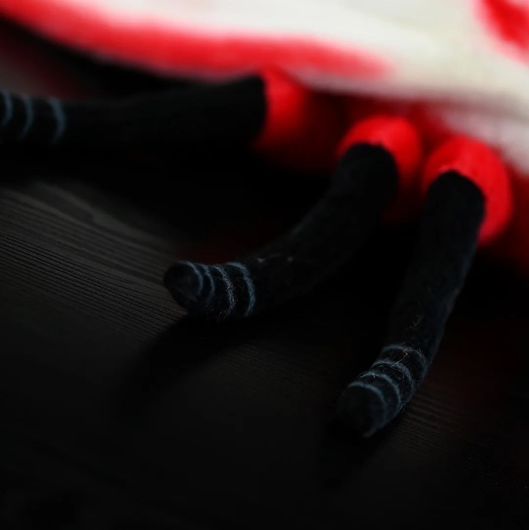 Detailed shot of the legs on the Rosy Ermine Moth Plush by SoftDaysLab®, mimicking the anatomy of Trosia nigropunctigera