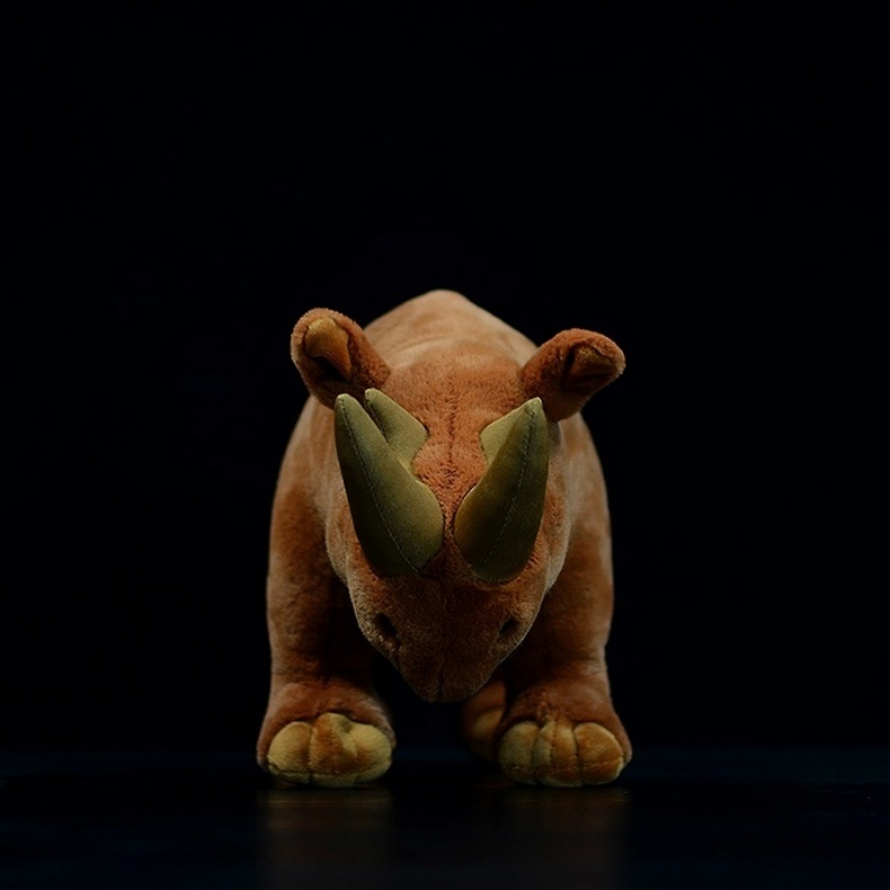 Front view of Arsinoitherium plush toy showcasing its iconic twin horns and prehistoric design