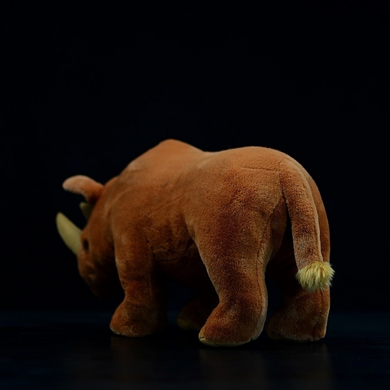 Rear view of Arsinoitherium plush toy, highlighting its soft tail and sturdy legs