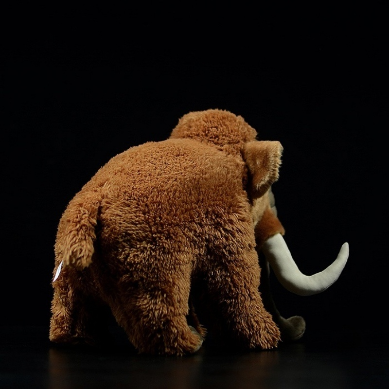 Rear view of woolly mammoth plush toy highlighting its fluffy fur and short tail in soft brown tones