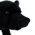 Close-up of black pig plush toy’s snout, emphasizing its realistic texture and adorable design