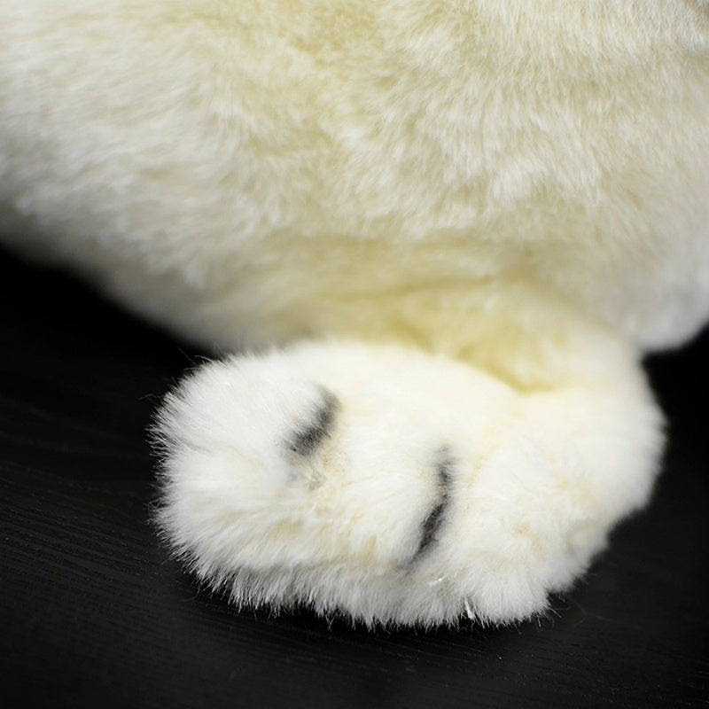 Fluffy front flippers of a white seal pup plush toy, showcasing realistic design, by SoftDaysLab