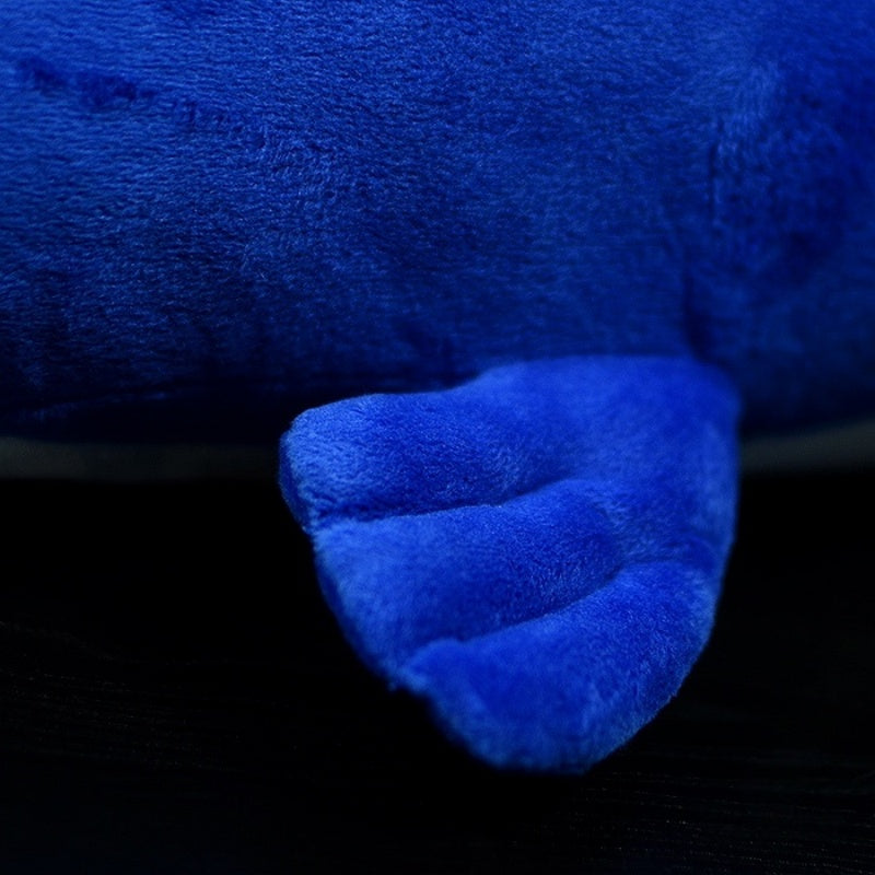 Detailed shot of the sperm whale plush toy's flipper, featuring soft and huggable fabric