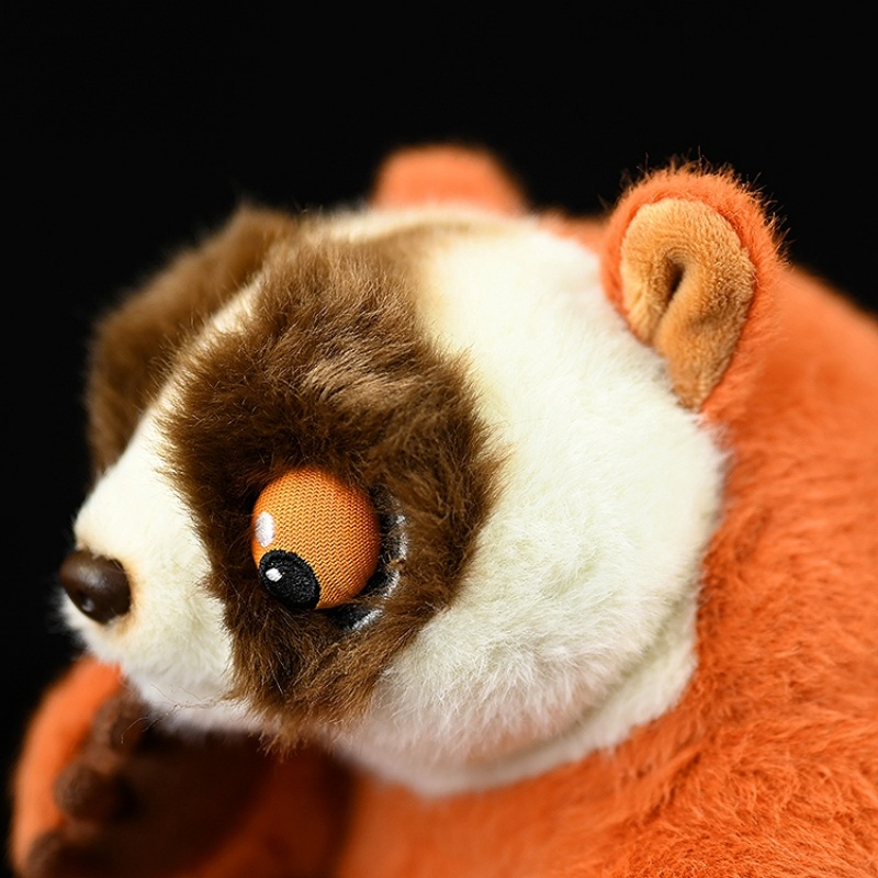 Close-up of the red slender loris plush’s lifelike eyes and soft facial texture by SoftDaysLab