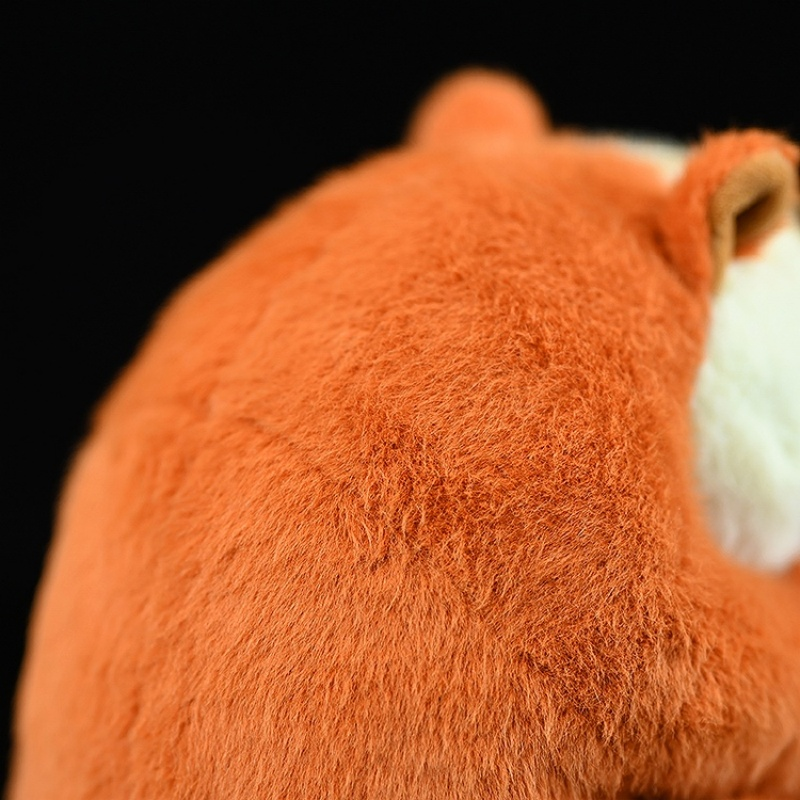 Close-up of the red slender loris plush toy’s fluffy back fur, emphasizing its realistic design