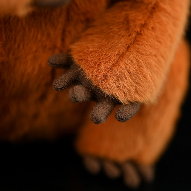 Zoomed-in view of the red slender loris plush toy’s detailed paws with soft material