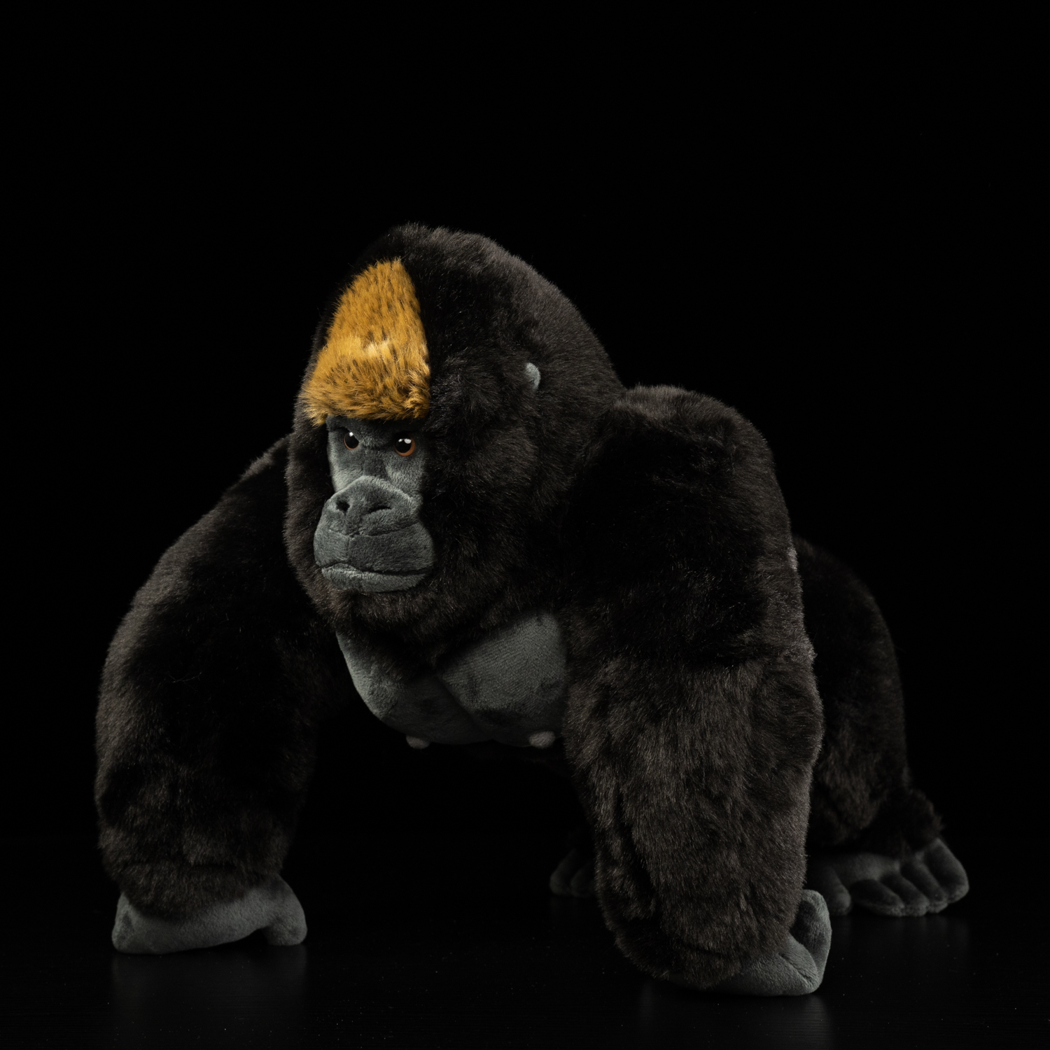 Side view of the silverback gorilla plush toy highlighting its soft texture and detailed design