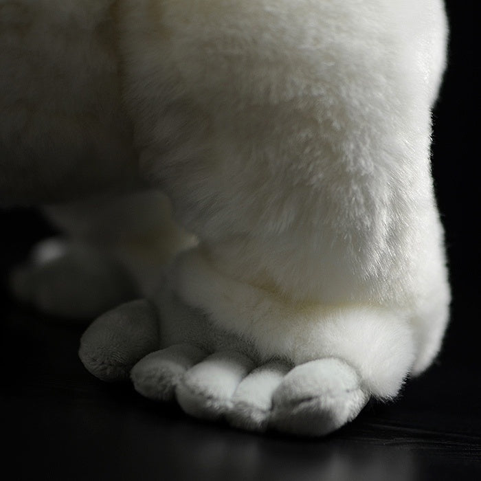 Detailed view of the white gorilla’s plush foot, emphasizing realistic and soft craftsmanship