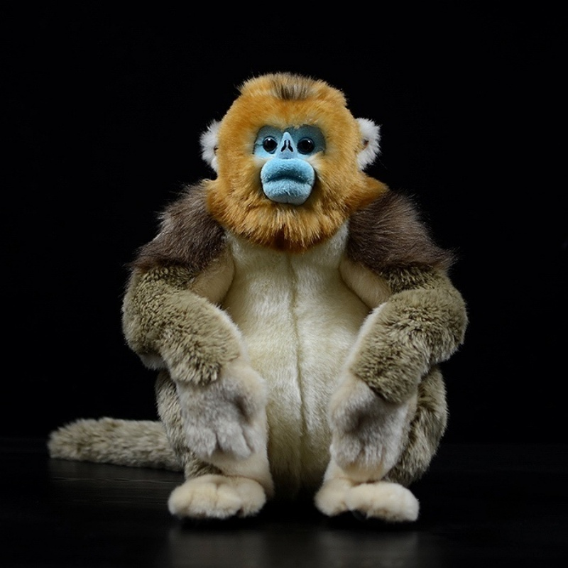 Front view of a golden snub-nosed monkey plush toy with detailed fur and blue face by SoftDaysLab