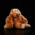 Side view of hanging orangutan plush toy with lifelike design and soft fur, ideal for kids and collectors