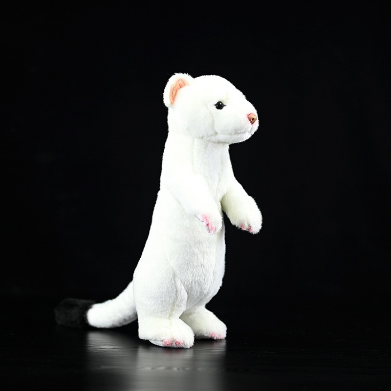 Side view of a standing ermine plush toy with a white body and black tail by SoftDaysLab