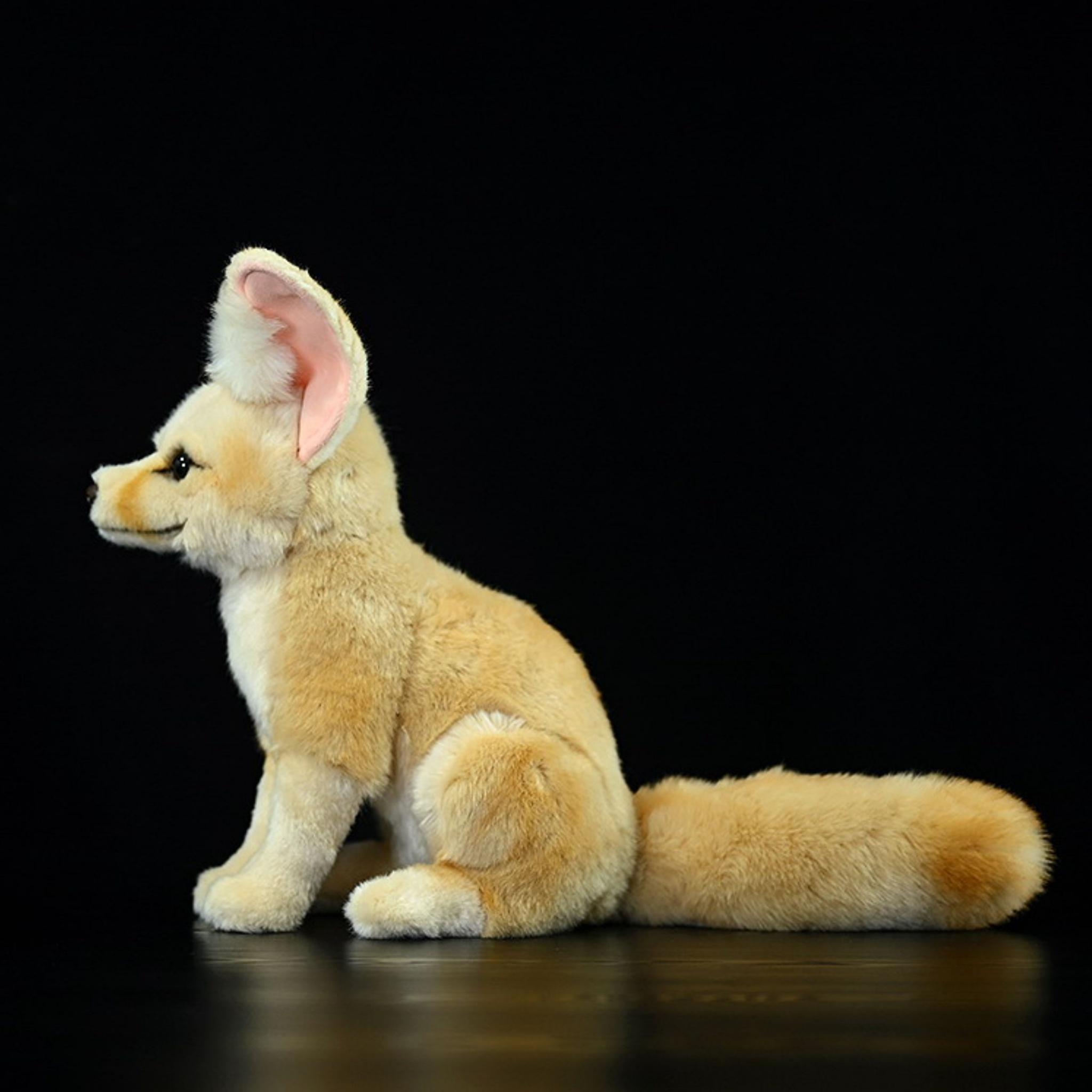 Side profile of a fennec fox plush toy showing lifelike details and fluffy tail by SoftDaysLab