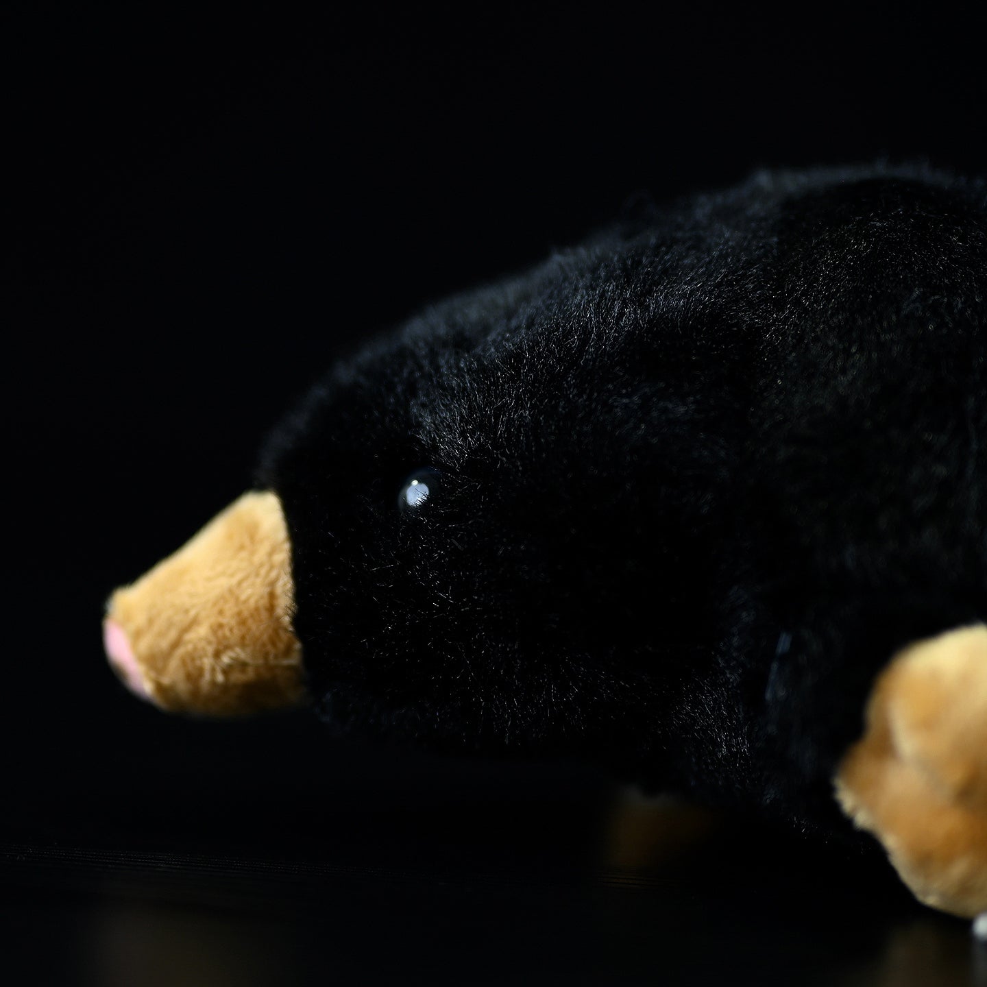 Close-up of the mole plush toy's face, focusing on its detailed snout and soft fur