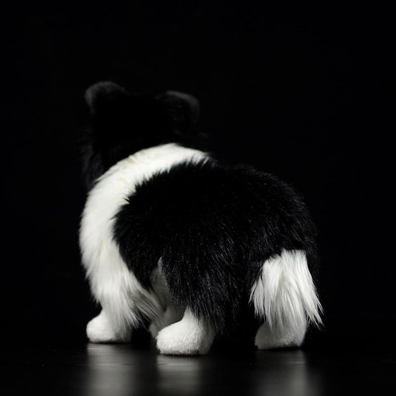 Rear view of a Border Collie plush toy with fluffy tail and soft fur, perfect for cuddling