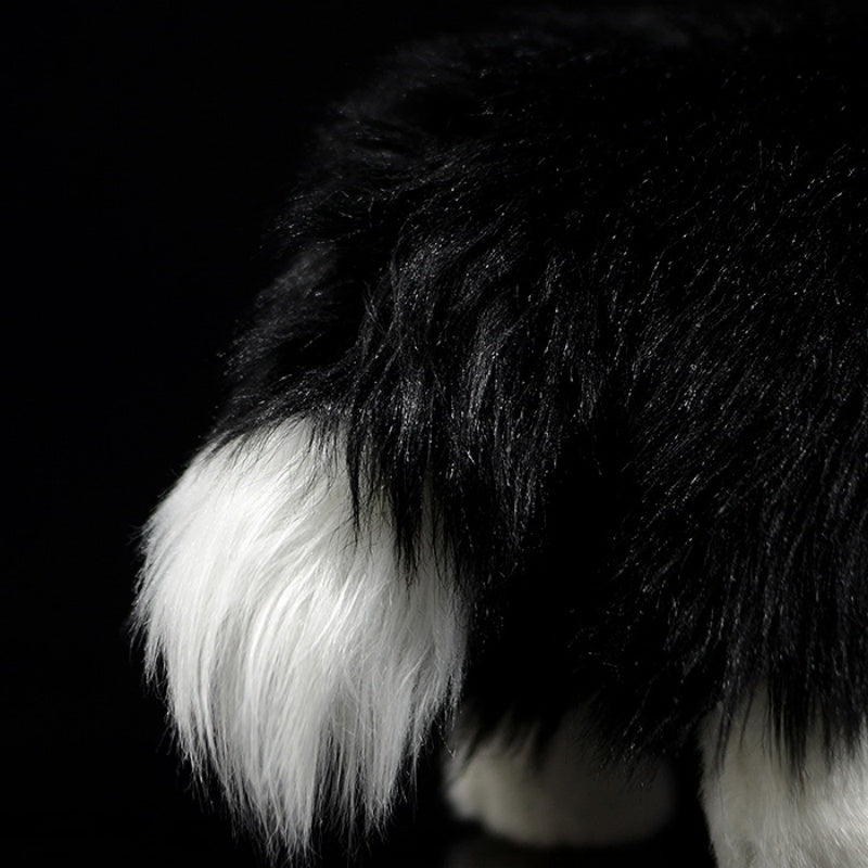 Fluffy tail of Border Collie plush toy with black-and-white fur, perfect for collectors