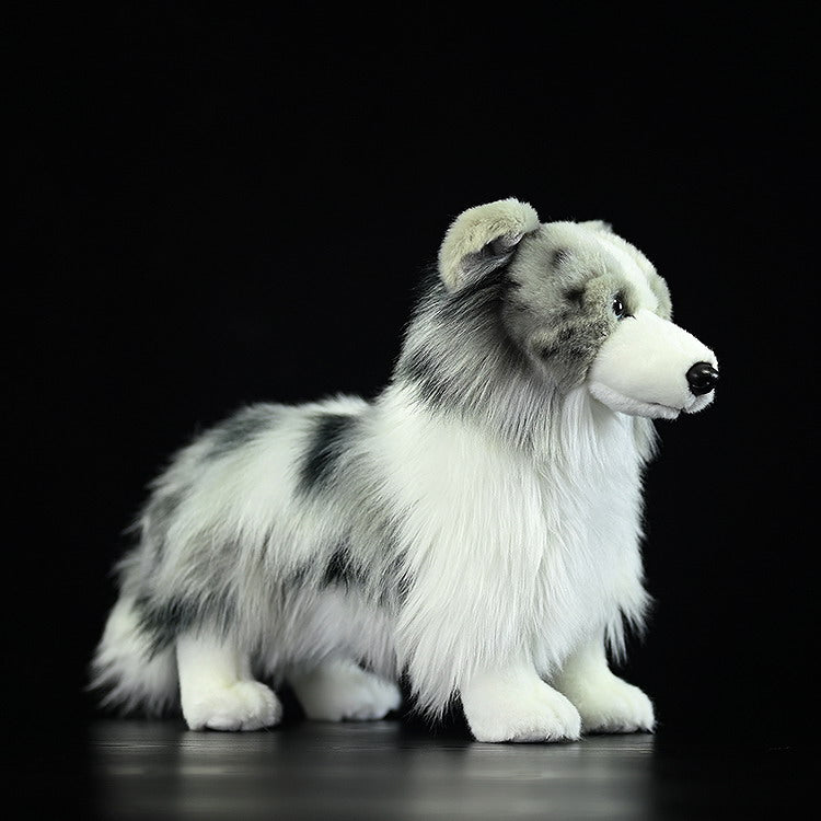 Side view of Blue Merle Border Collie plush, showcasing its soft fur and lifelike markings