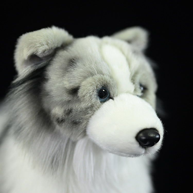 Face close-up of Blue Merle Border Collie plush toy, showing lifelike eyes and soft nose