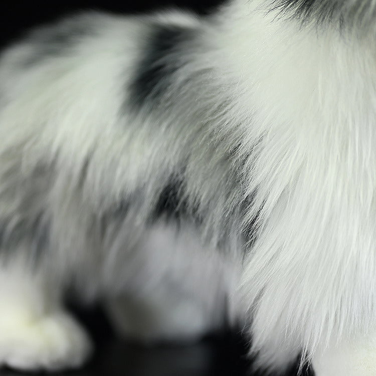 Detailed side view of Blue Merle Border Collie plush’s soft, lifelike coat in white and gray tones