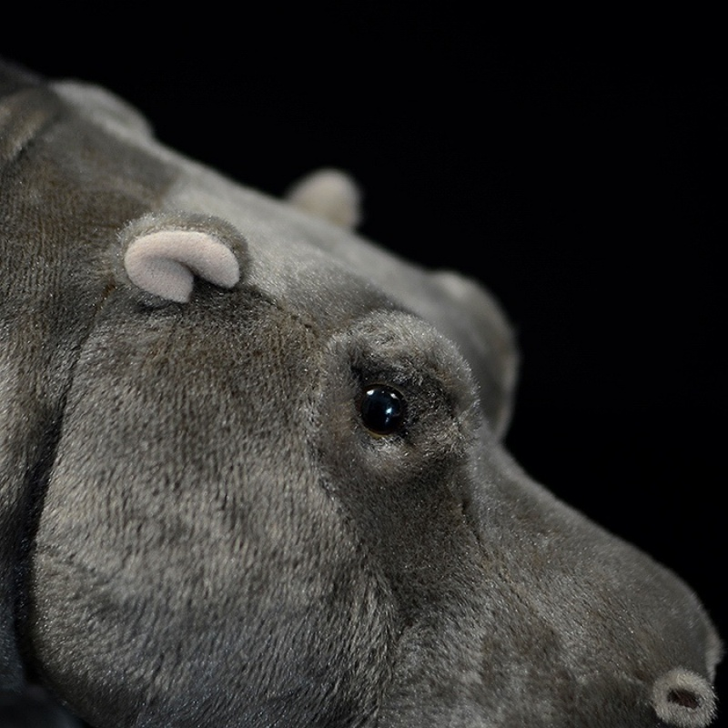  Close-up of hippo plush toy's ear and eye, highlighting intricate and realistic details