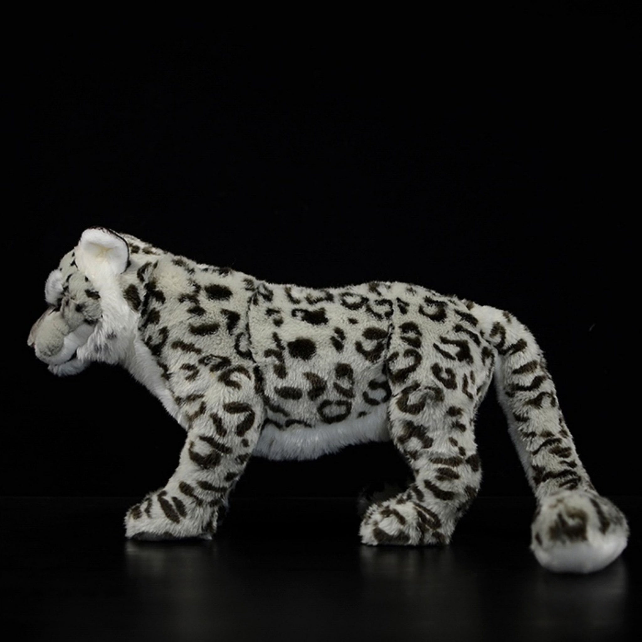 Side view of snow leopard plush toy showing detailed spots and realistic design by SoftDaysLab