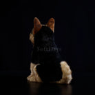 Rear view of German Shepherd dog plush toy sitting, highlighting its fluffy coat and detailed markings
