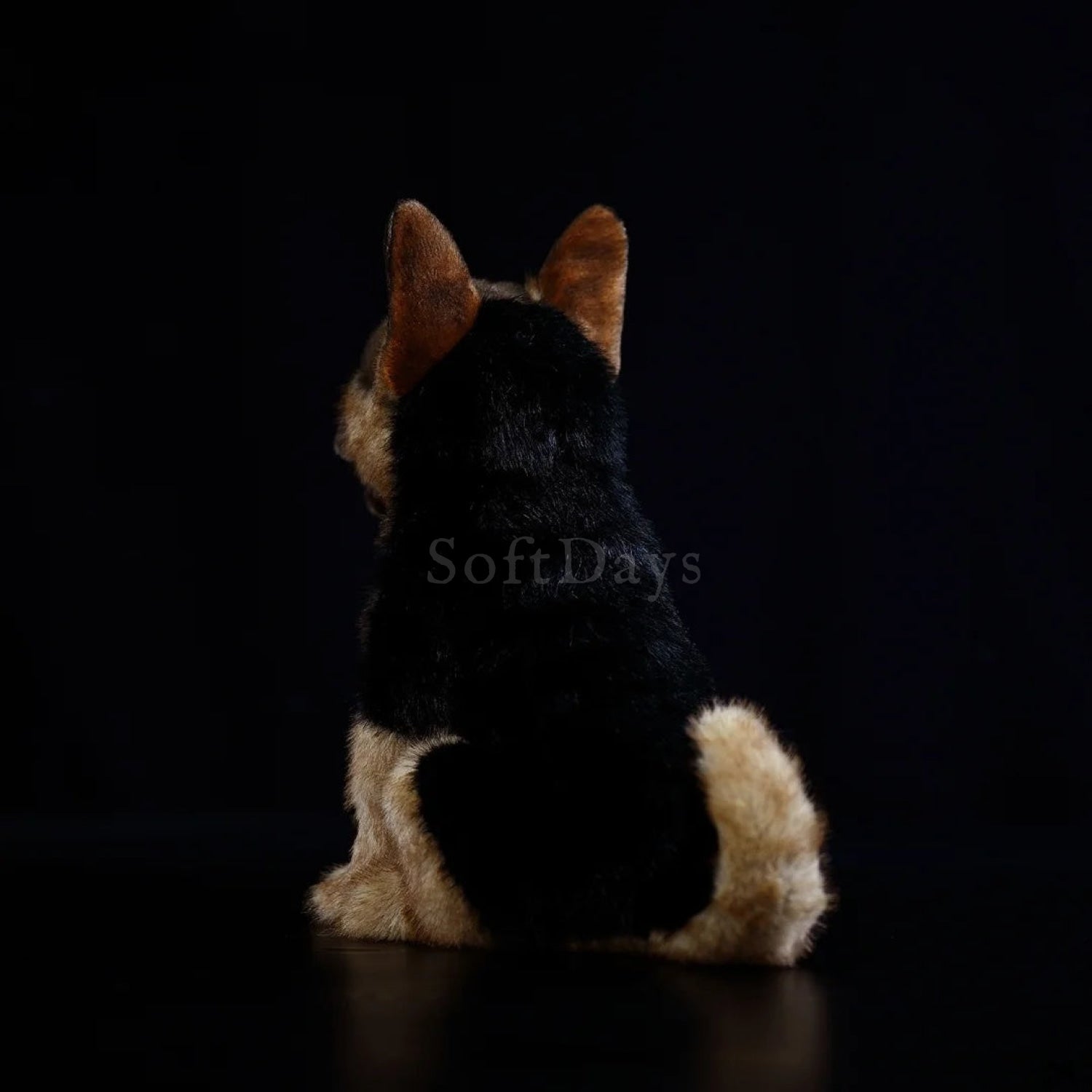 Rear view of German Shepherd dog plush toy sitting, highlighting its fluffy coat and detailed markings