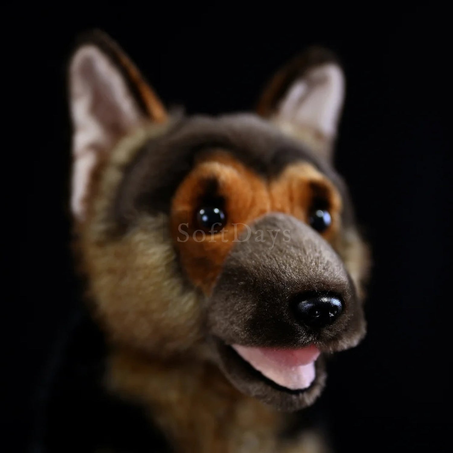 Close-up of lifelike German Shepherd plush toy's face, featuring detailed eyes, nose, and lifelike ears