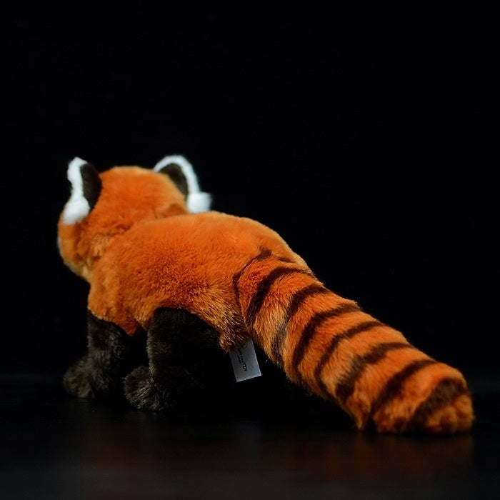 Back view of a red panda plush toy featuring its striped tail and high-quality fur detail