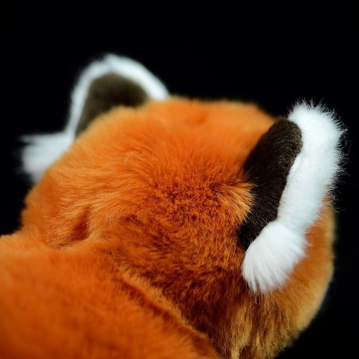 Detailed view of the red panda plush toy's ears, crafted with soft materials for a realistic touch