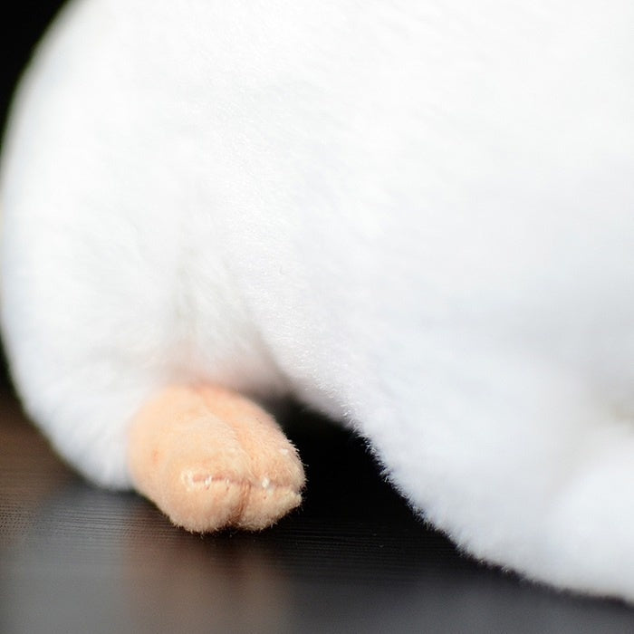 Close-up of the white lab mouse plush toy’s paw, showcasing its realistic and delicate design