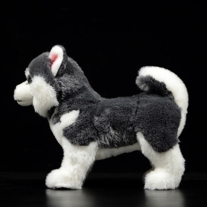 Side profile of a grey and white Alaskan Malamute plush toy showcasing its fluffy double coat