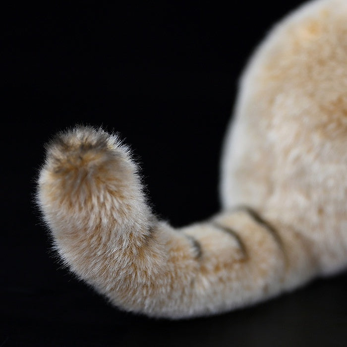 Fluffy tail of lifelike sand cat plush toy, showcasing realistic markings and soft texture