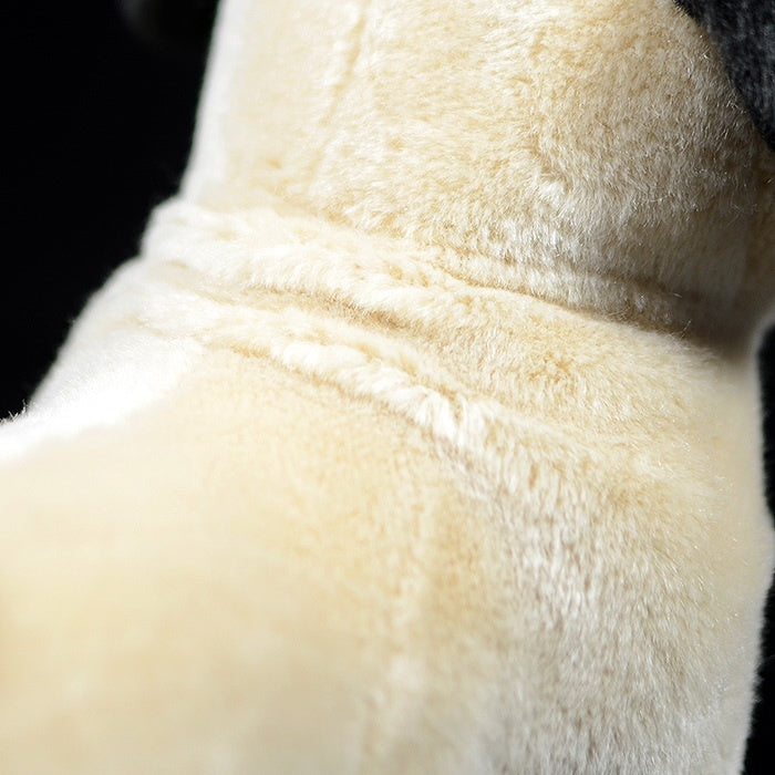 Zoomed-in view of a fawn pug plush’s soft beige fur with realistic detailing