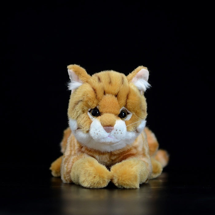 Front view of a cute orange tabby cat plush with lifelike stripes and a soft, cuddly design