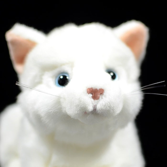 Close-up of white cat plush toy’s charming face and lifelike whiskers, soft and adorable by SoftDaysLab