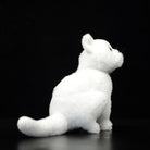 Rear view of white cat plush toy, highlighting its fluffy tail and realistic craftsmanship
