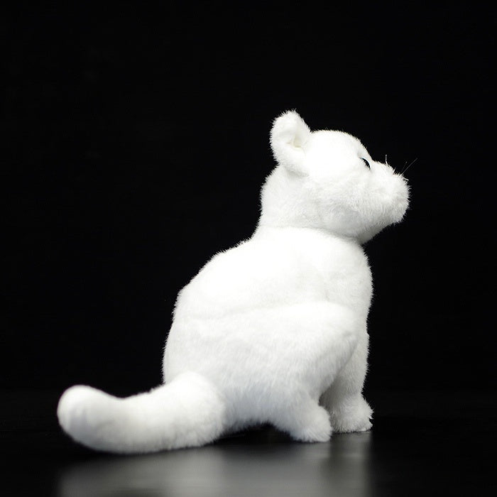 Rear view of white cat plush toy, highlighting its fluffy tail and realistic craftsmanship