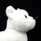 Side view of the white cat plush head, emphasizing its realistic fur texture and gentle expression